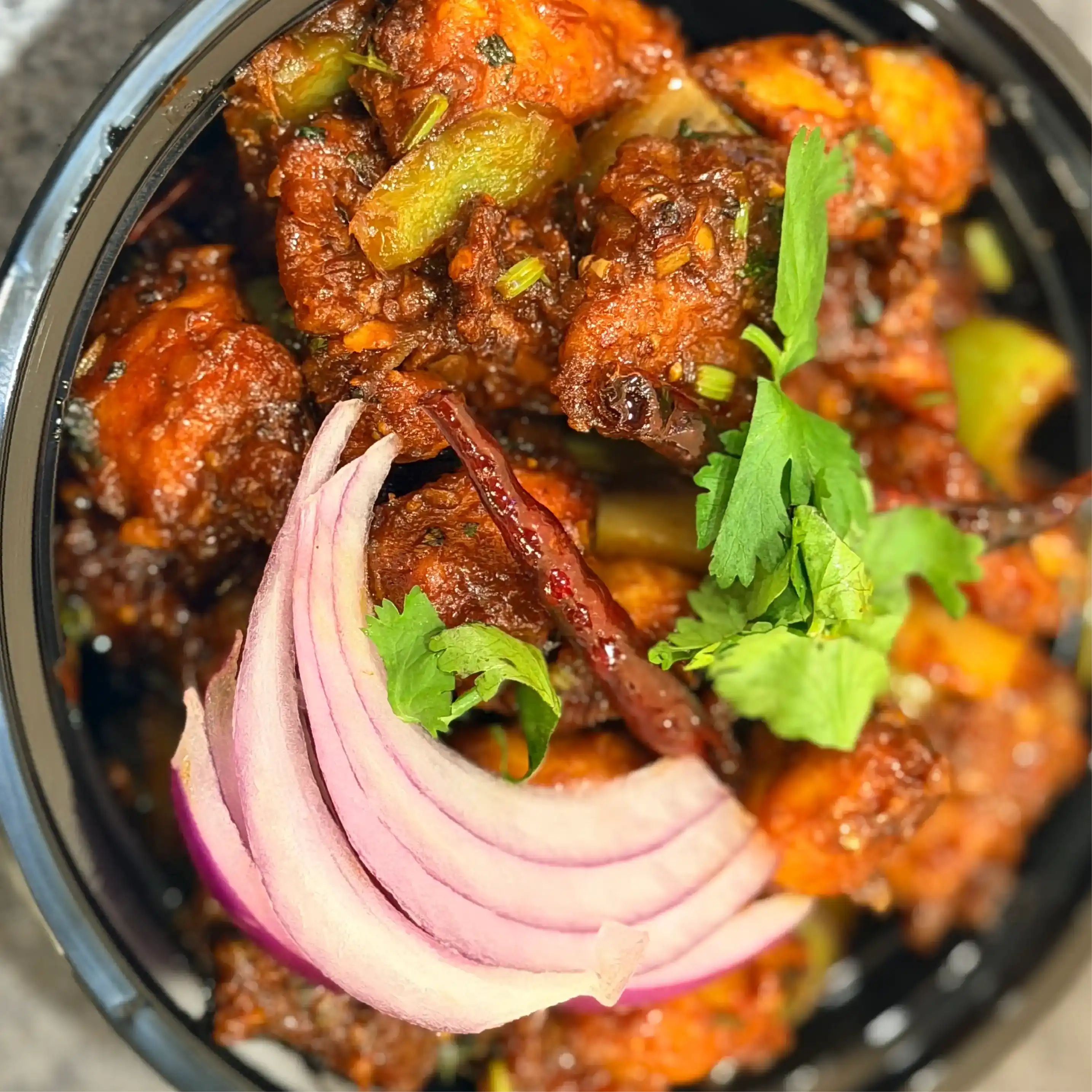 Schezwan Chilli Chicken — Experience the fiery kick of Schezwan Chilli Chicken at Hashtag India, Overland Park